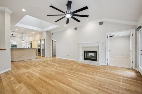 a view of an empty room with a fireplace