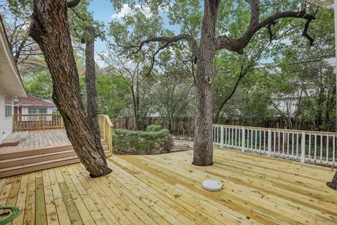 a view of outdoor space with deck and garden