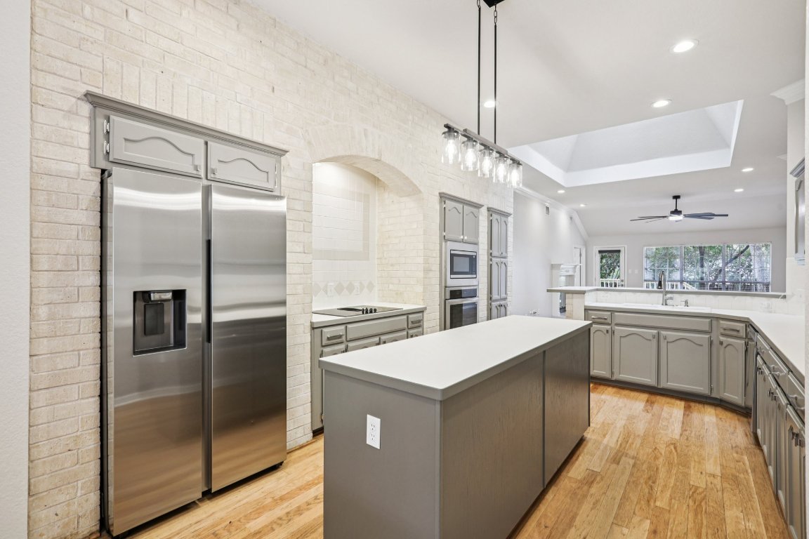 8109 Isaac Pryor Drive Austin, TX 78749 - Photo 5 of 20 a kitchen with a refrigerator a sink and oven