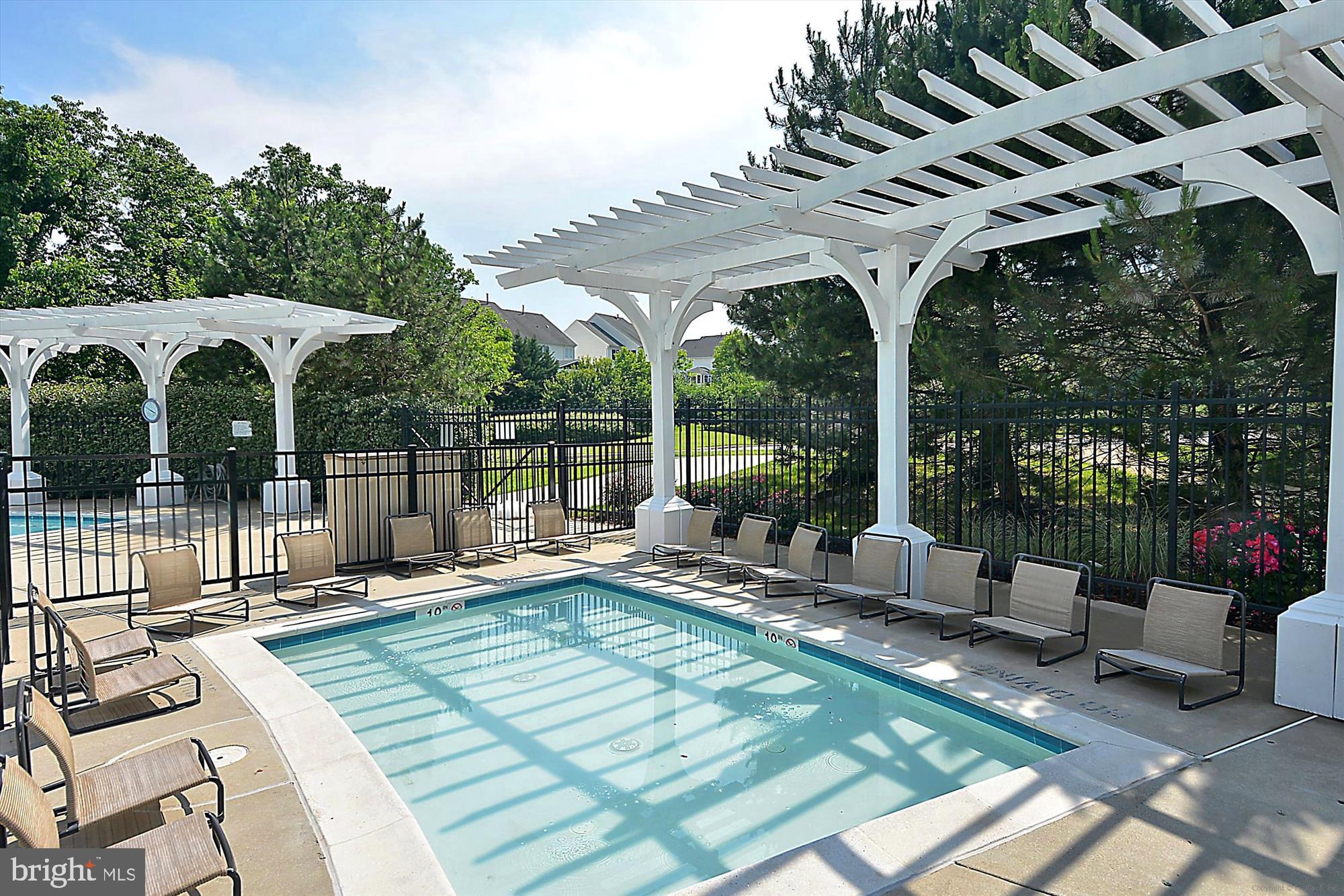 22678 Verde Gate Terrace Brambleton, VA 20148 - Photo 30 of 39 a view of a patio with a dining table and chairs with wooden floor and fence