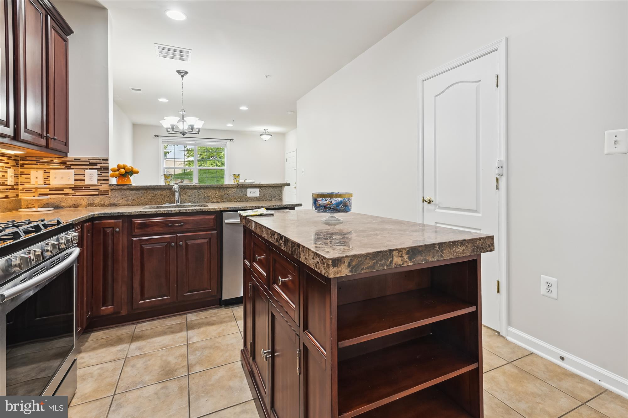 22678 Verde Gate Terrace Brambleton, VA 20148 - Photo 9 of 39 a kitchen with a stove and a sink