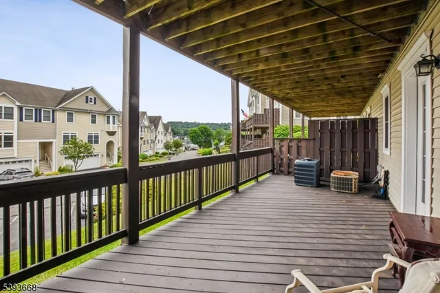 a view of a two chairs in the balcony