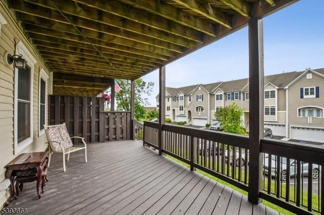 a view of a chairs and table in the balcony