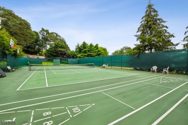 a view of a roof deck with couches and wooden floor
