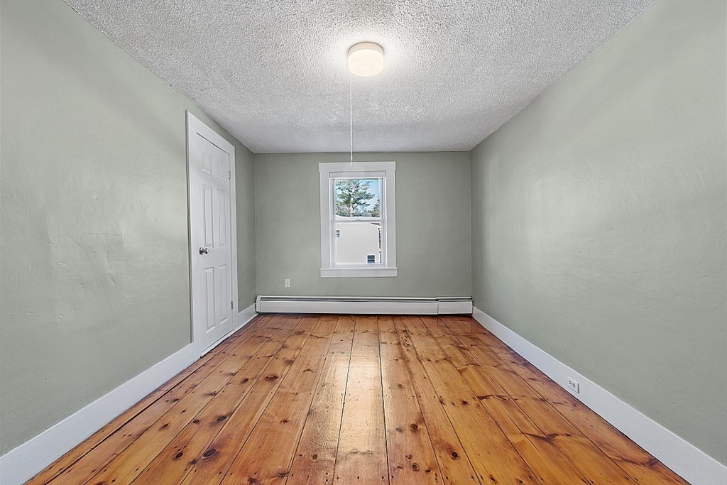 8 Main Street, Unit 2R Pepperell, MA 01463 - Photo 7 of 13 a view of an empty room and window
