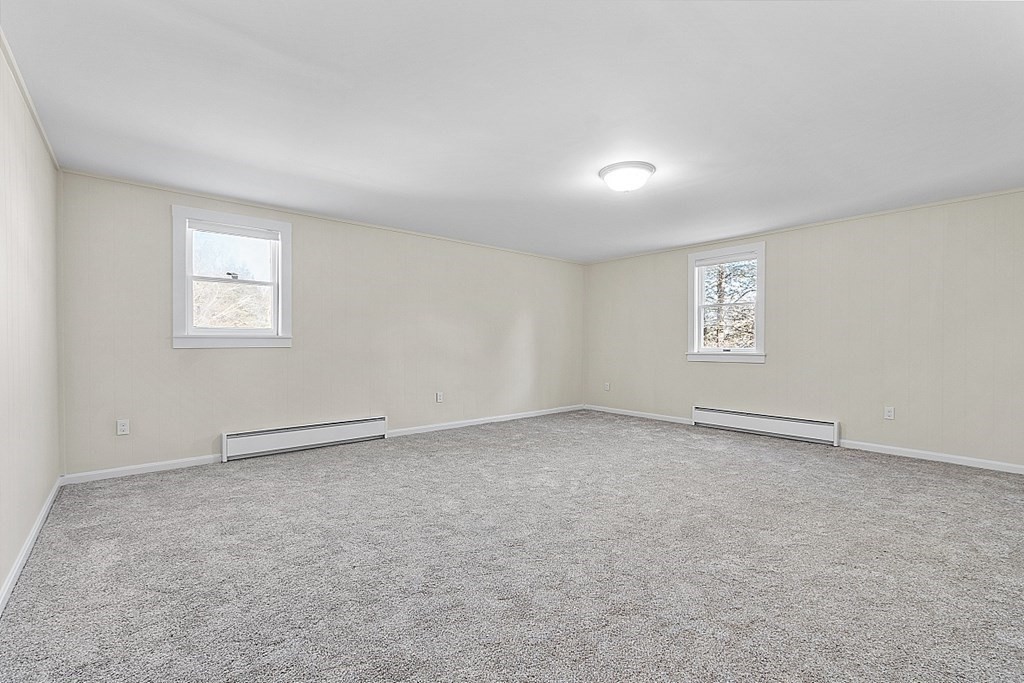 8 Main Street, Unit 2R Pepperell, MA 01463 - Photo 10 of 13 an empty room with a window