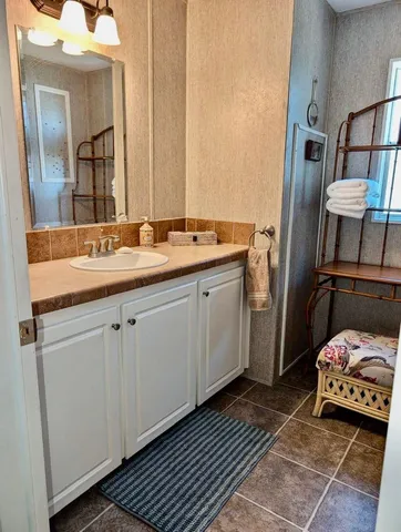 a bathroom with a sink and a mirror