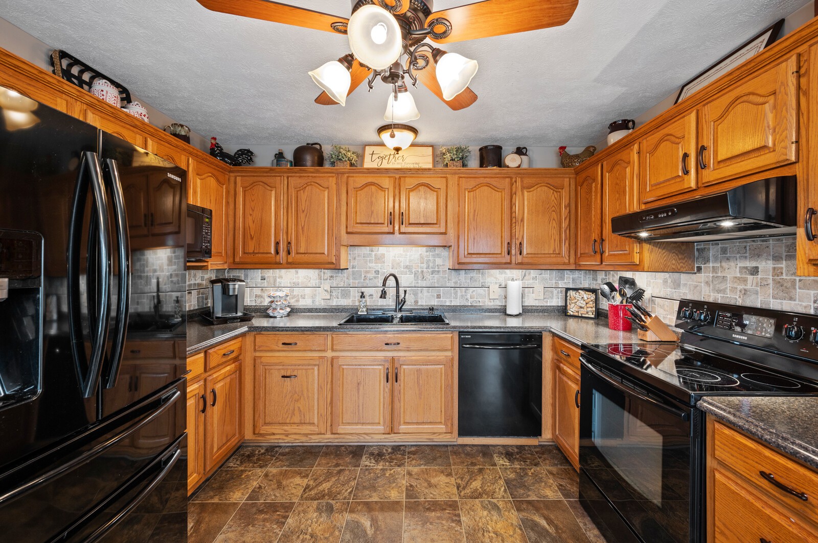 6388 Franklin Road Lebanon, TN 37090 - Photo 11 of 27 a kitchen with stainless steel appliances granite countertop a stove cabinets a sink and dishwasher
