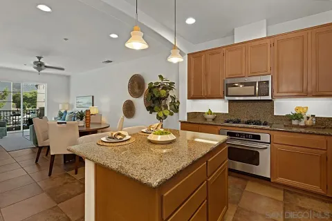a kitchen with sink stove and cabinets
