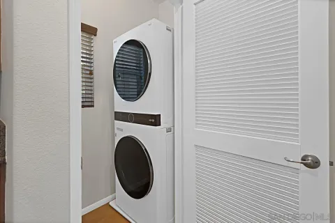 a close view of a utility room with dryer and washer