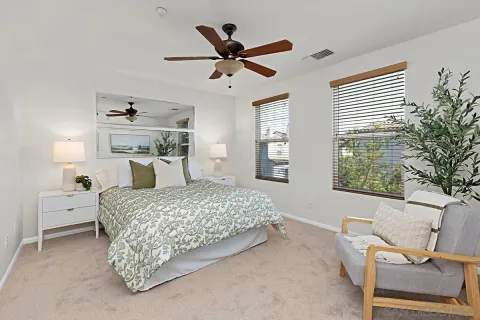 a bedroom with a bed and window