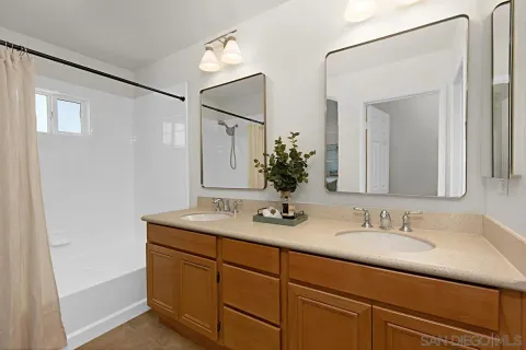 a bathroom with a granite countertop sink a mirror and a