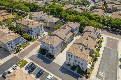 an aerial view of a house with a yard