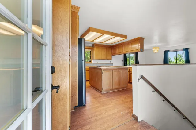 a view of a kitchen from a hallway