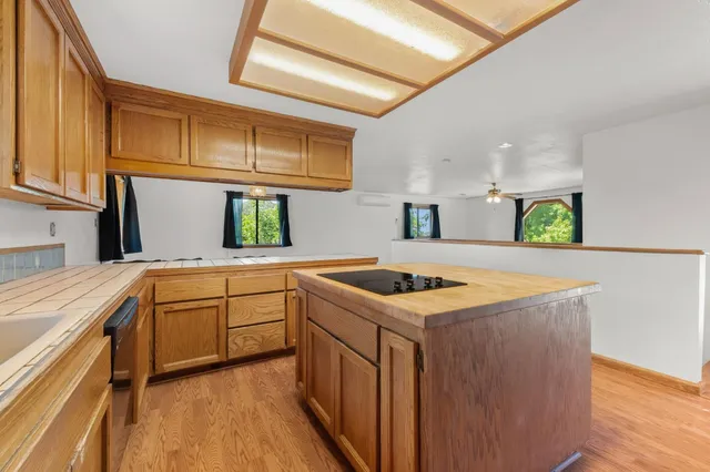 a kitchen with a stove a sink and a refrigerator