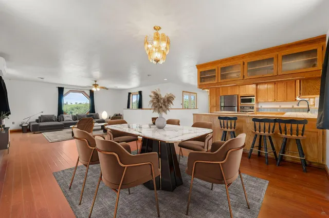 a dinning table and chairs in a room