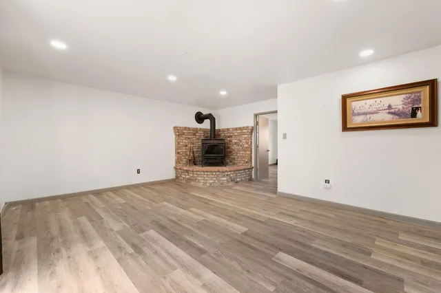 a view of a livingroom with furniture and an empty room