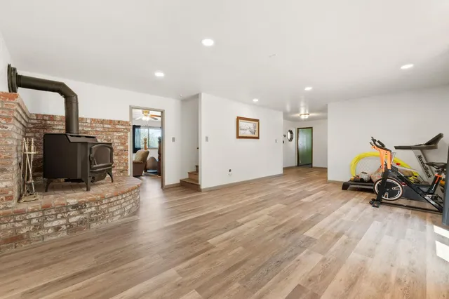 a view of a livingroom with furniture and a flat screen tv
