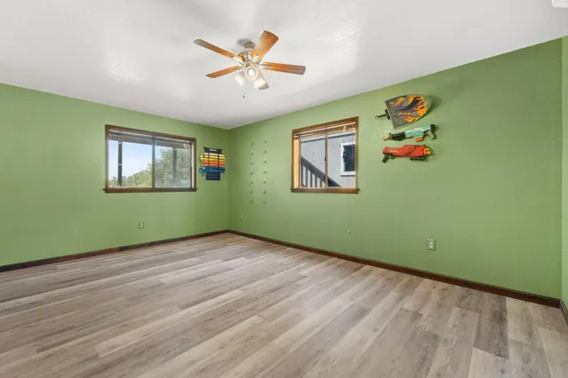 a view of a room with window and wooden floor