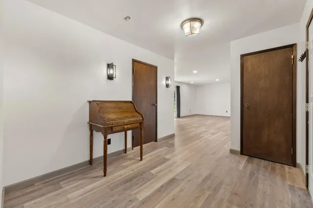 a room with wooden floor and a table