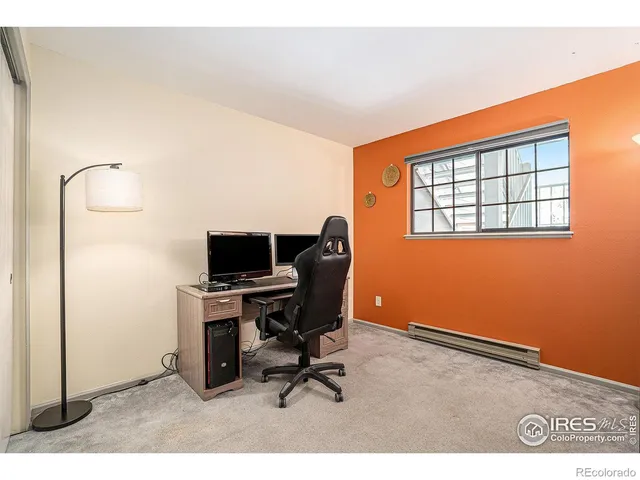 a workspace with furniture and window