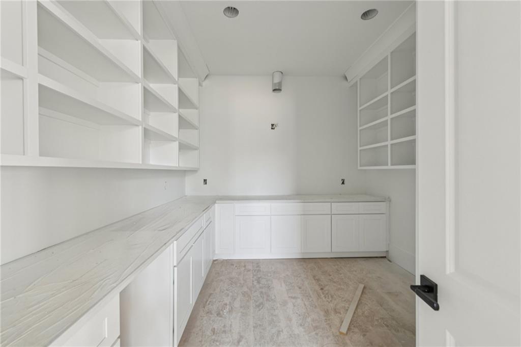3207 Thompson Mill Road Buford, GA 30519 - Photo 11 of 35 a view of storage and utility room with cabinets