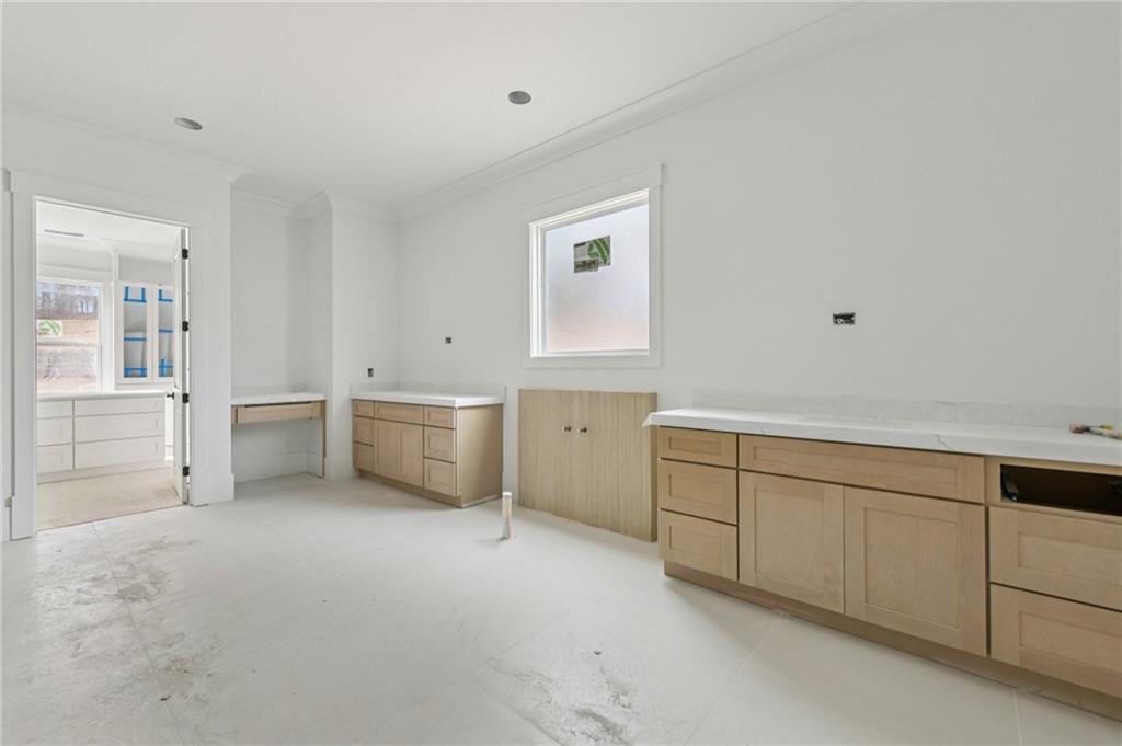 3207 Thompson Mill Road Buford, GA 30519 - Photo 13 of 35 a view of a kitchen with white cabinets