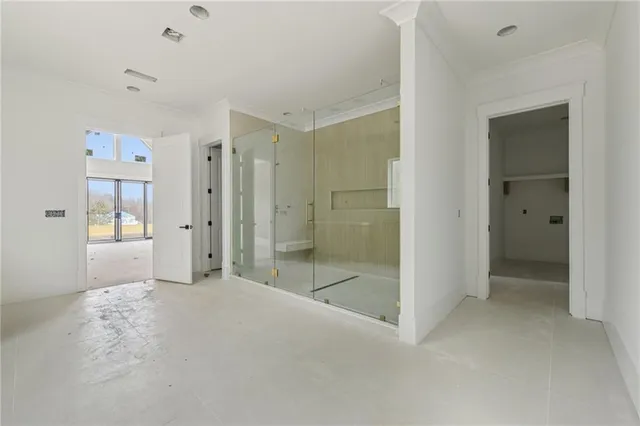 a bathroom with a shower and a sink