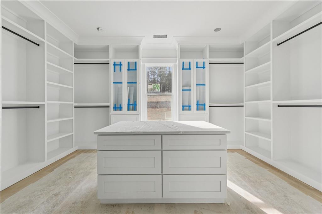 3207 Thompson Mill Road Buford, GA 30519 - Photo 15 of 35 a kitchen with a refrigerator and white cabinets