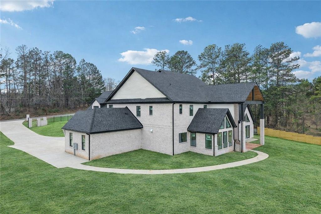 3207 Thompson Mill Road Buford, GA 30519 - Photo 31 of 35 a view of a house with a yard balcony and a slide