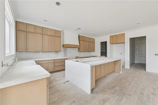 a kitchen with stainless steel appliances a stove a sink and a refrigerator