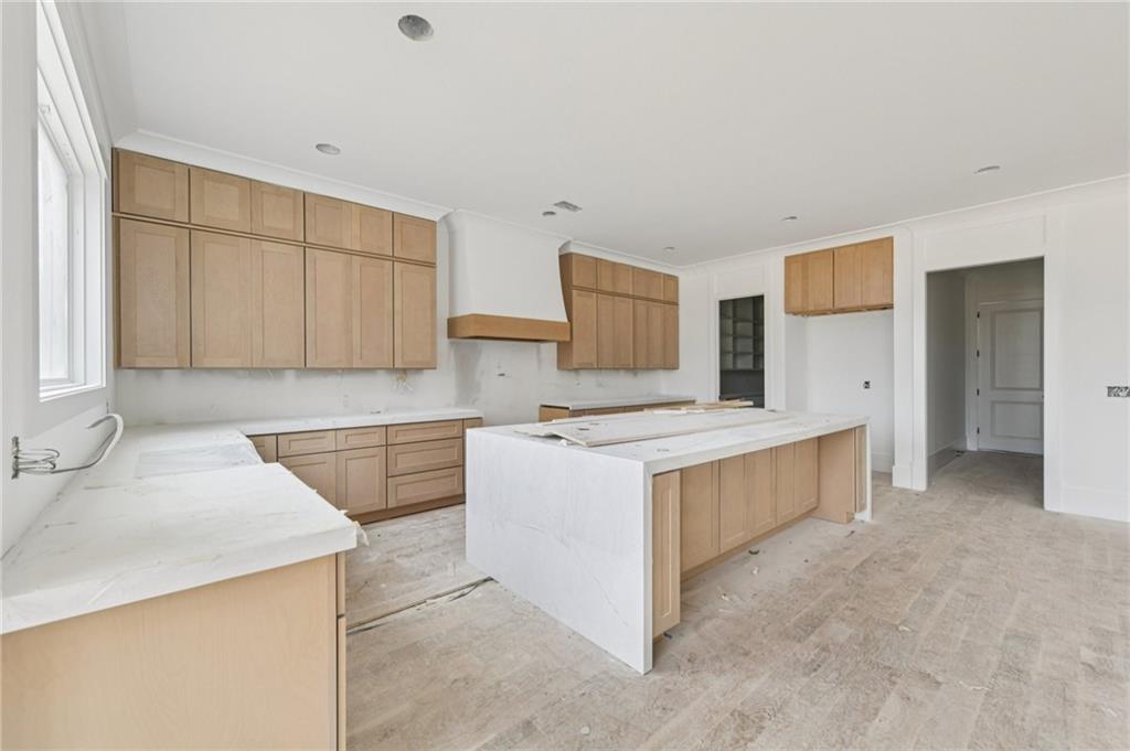 3207 Thompson Mill Road Buford, GA 30519 - Photo 9 of 35 a kitchen with stainless steel appliances a stove a sink and a refrigerator