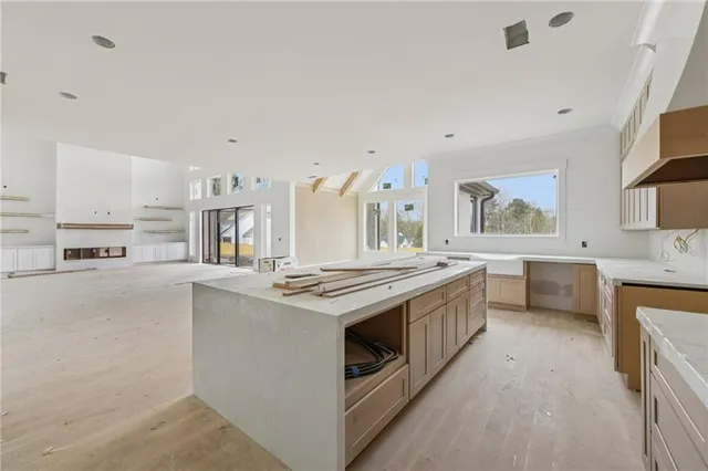 a kitchen with stainless steel appliances a sink stove and cabinets