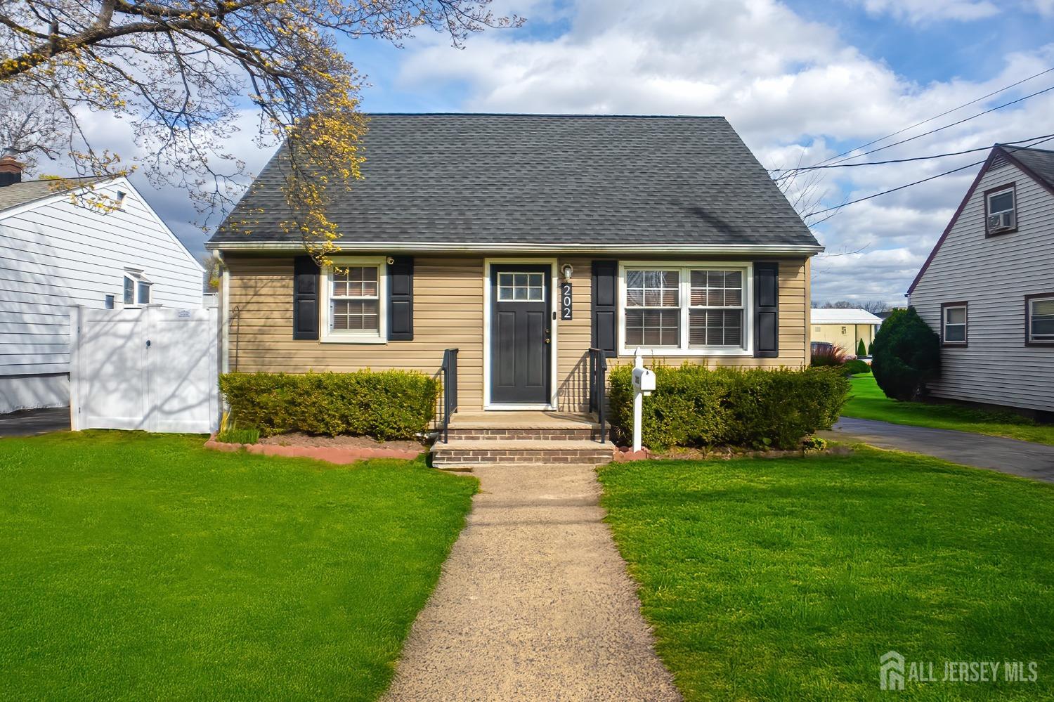 202 Jackson Avenue Edison, NJ 08837 - Photo 1 of 35 a front view of a house with a yard