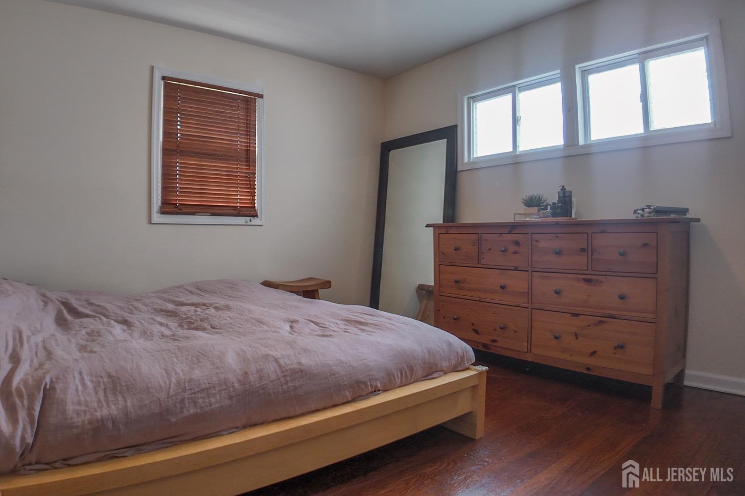 202 Jackson Avenue Edison, NJ 08837 - Photo 13 of 35 a bedroom with a bed and a window