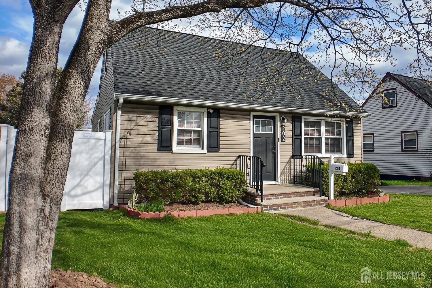 202 Jackson Avenue Edison, NJ 08837 - Photo 2 of 35 front view of a house with a yard