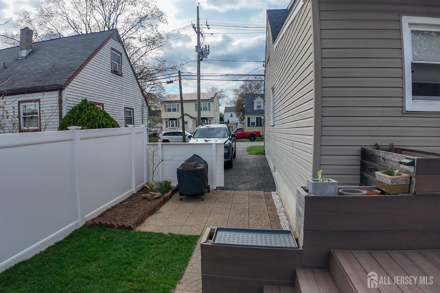 202 Jackson Avenue Edison, NJ 08837 - Photo 32 of 35 a view of a porch with furniture and garden