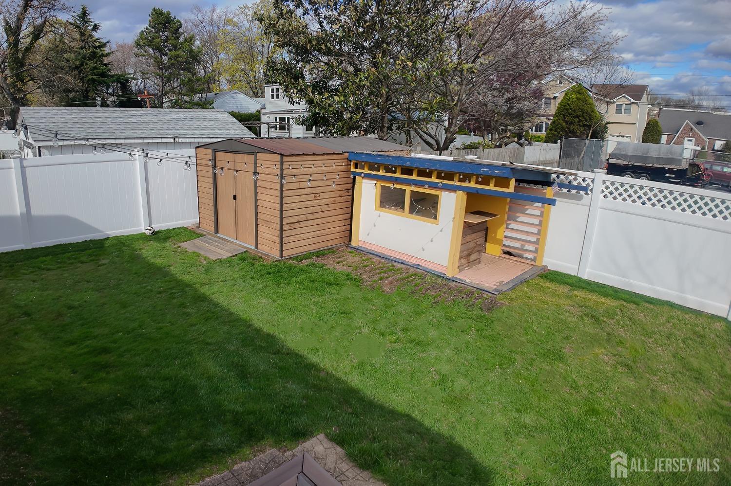 202 Jackson Avenue Edison, NJ 08837 - Photo 34 of 35 a view of a house with a yard and sitting area