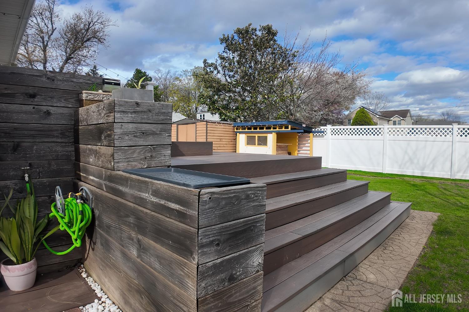 202 Jackson Avenue Edison, NJ 08837 - Photo 35 of 35 a view of a garden with large trees