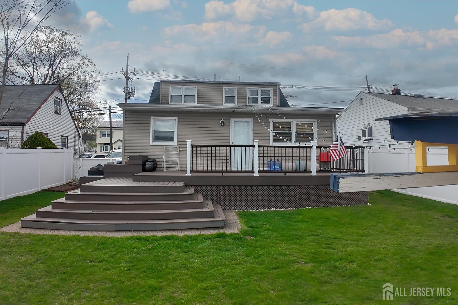 202 Jackson Avenue Edison, NJ 08837 - Photo 4 of 35 a front view of a house with a garden and deck