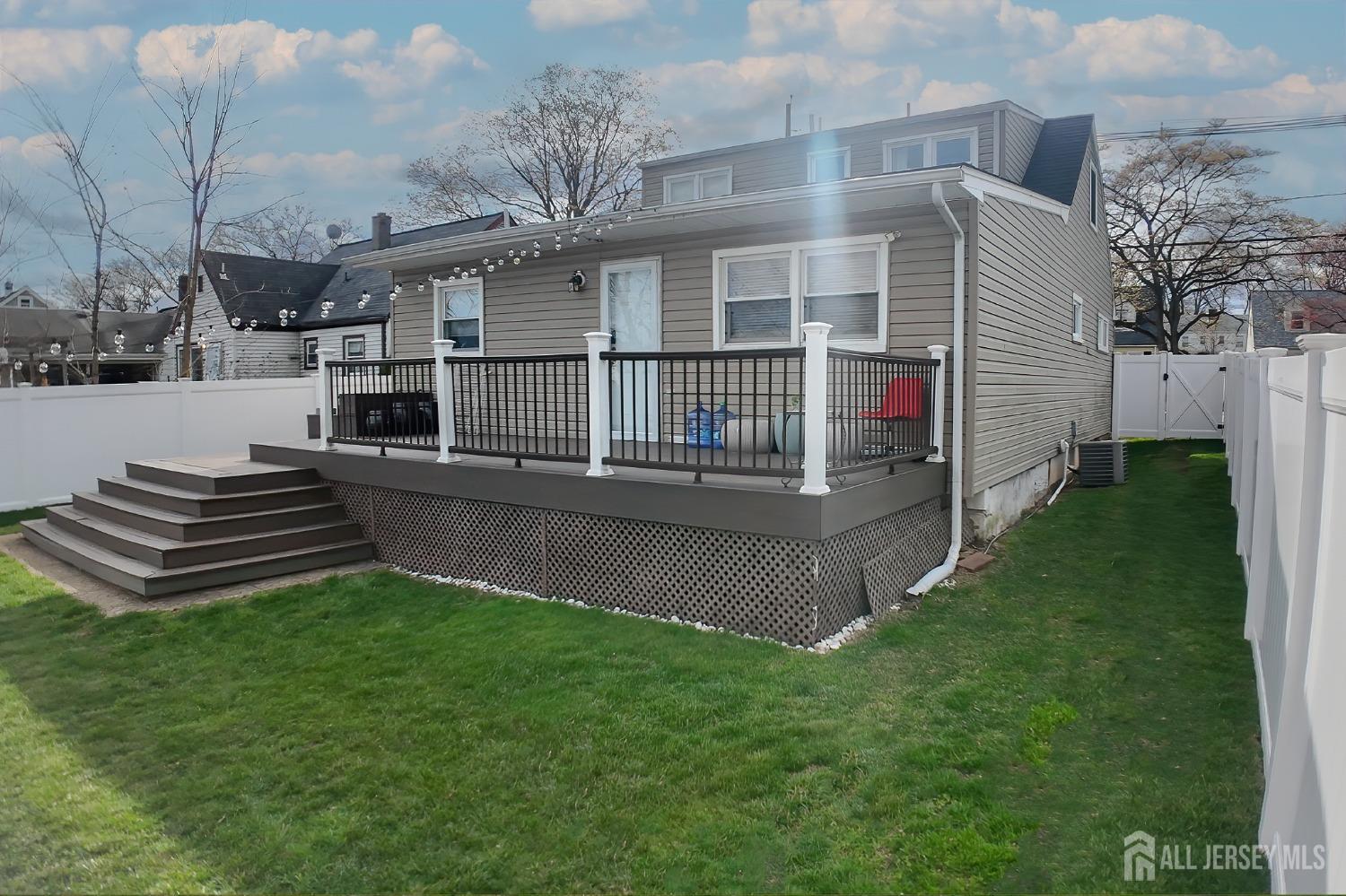 202 Jackson Avenue Edison, NJ 08837 - Photo 5 of 35 a view of a house with a yard and sitting area