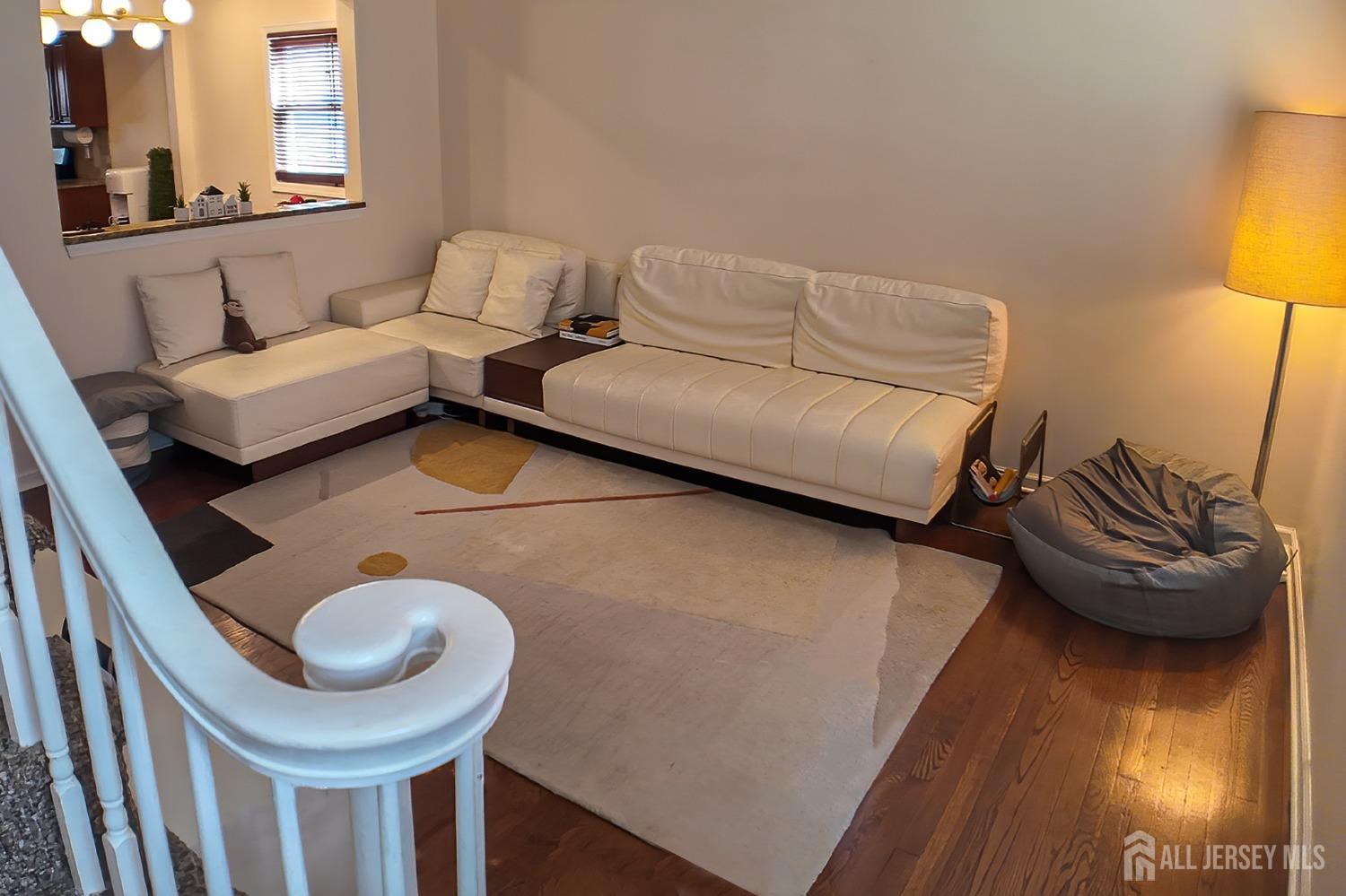 202 Jackson Avenue Edison, NJ 08837 - Photo 7 of 35 a living room with furniture and a wooden floor