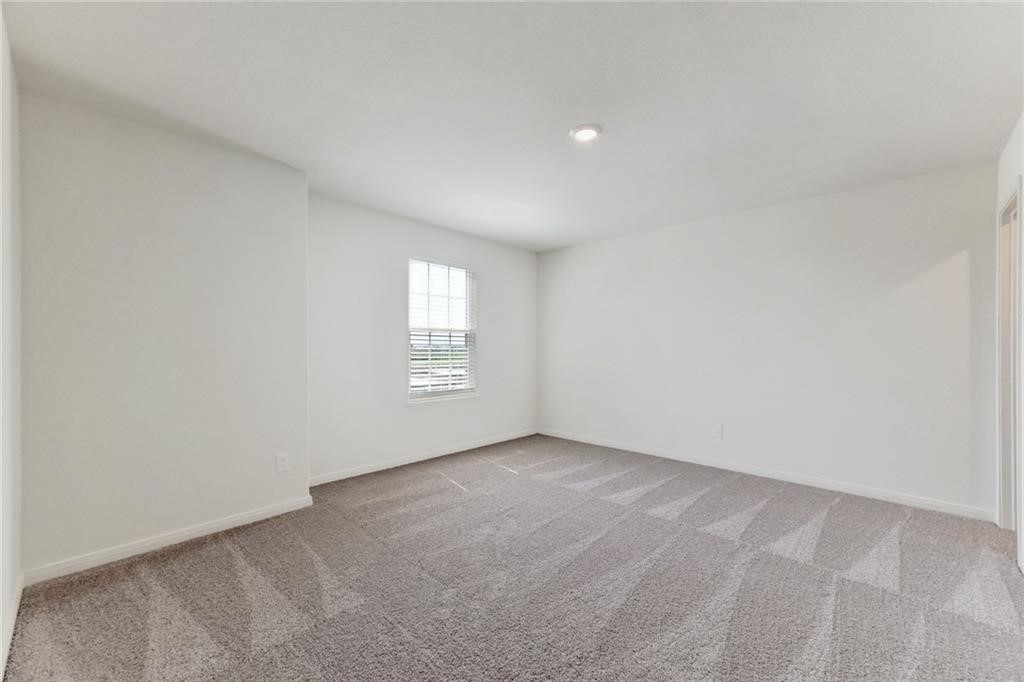 112 Dupont Pass Jarrell, TX 76537 - Photo 12 of 17 a view of an empty room with a window