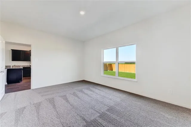 an empty room with a empty space and a window