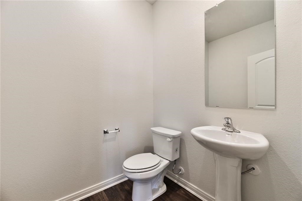 112 Dupont Pass Jarrell, TX 76537 - Photo 6 of 17 a bathroom with a sink and a toilet