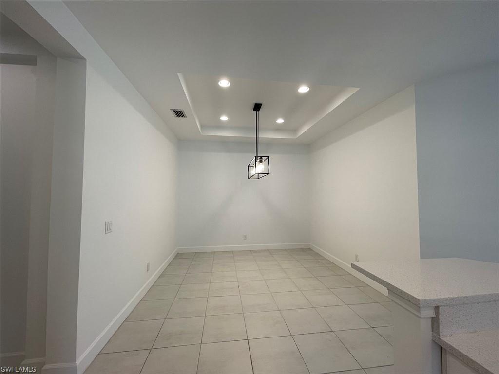 8217 Lucello Terrace West Naples, FL 34114 - Photo 13 of 41 an empty room with white walls and tiles