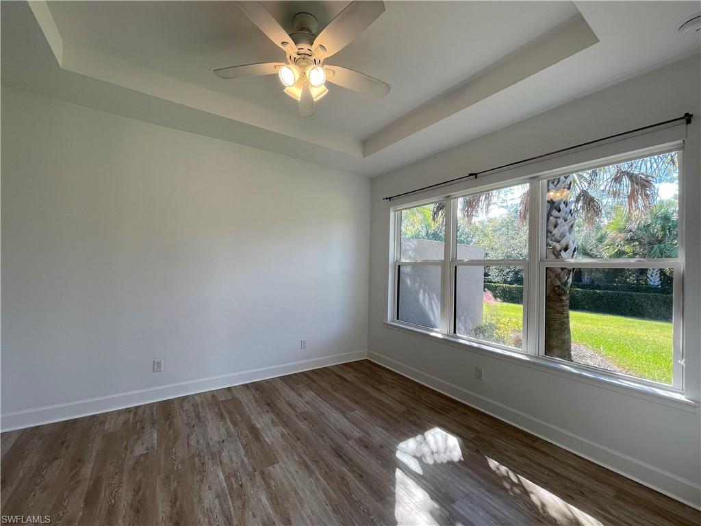 8217 Lucello Terrace West Naples, FL 34114 - Photo 15 of 41 an empty room with wooden floor and windows