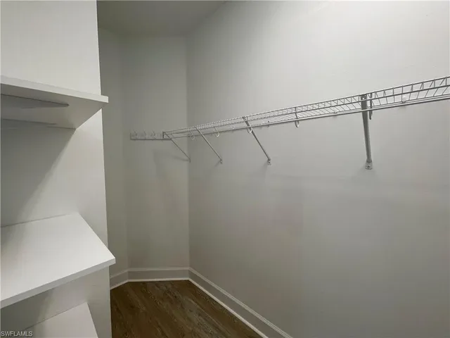 a view of an empty walk in closet