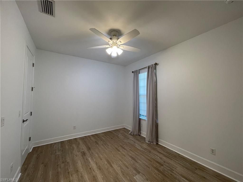 8217 Lucello Terrace West Naples, FL 34114 - Photo 22 of 41 wooden floor in an empty room