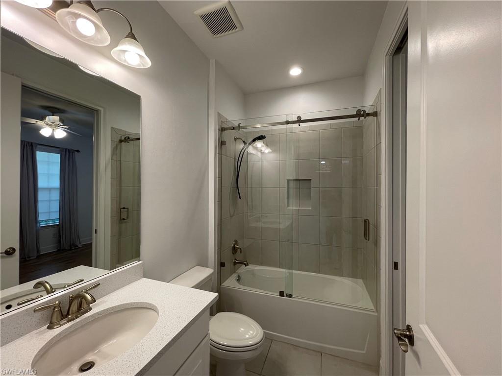 8217 Lucello Terrace West Naples, FL 34114 - Photo 24 of 41 a bathroom with a sink tub toilet and shower